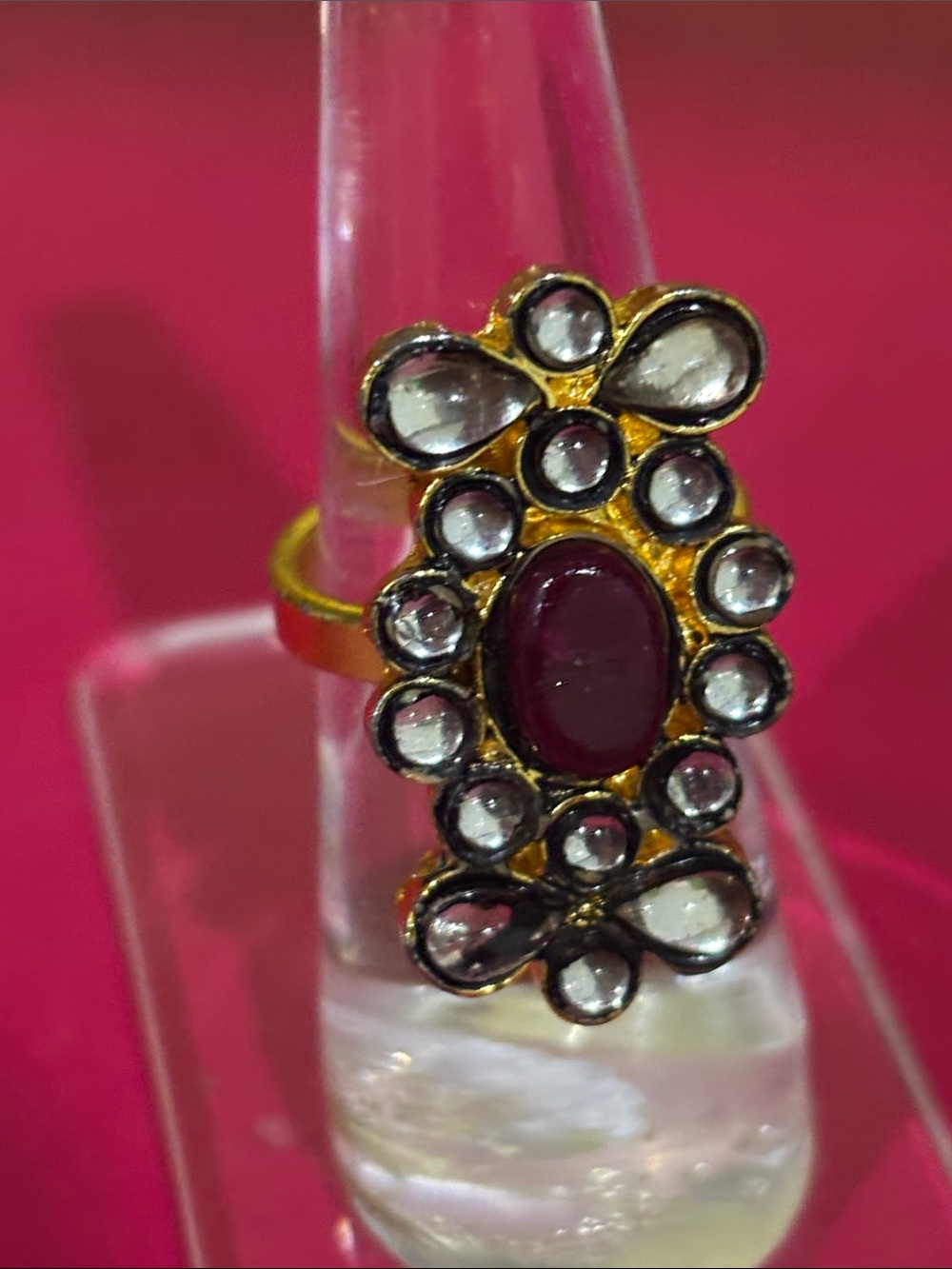 Gold-Tone Ring with Deep Ruby Center and Clear Stone Halo